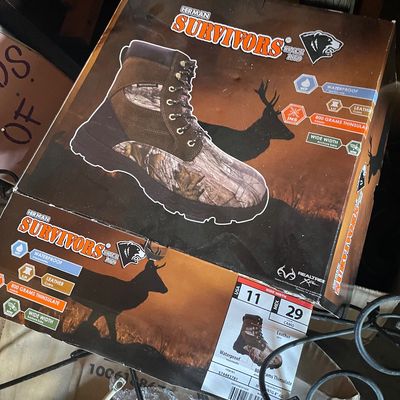 Sale Photo Thumbnail #194: Box of Herman Survivors waterproof camo hunting boots, size US 11 wide, featuring 800 grams Thinsulate insulation.