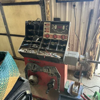 Sale Photo Thumbnail #95: Vintage Snap-on computer wheel balancer unit with built-in weight storage compartments, showing signs of heavy shop use.