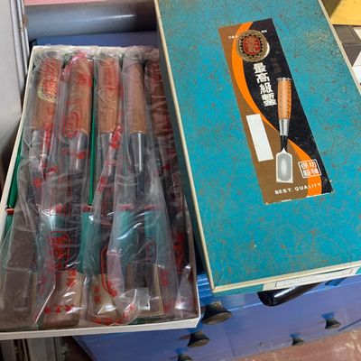 Boxed set of Japanese wood carving chisels, individually wrapped in plastic inside their original patterned presentation box.