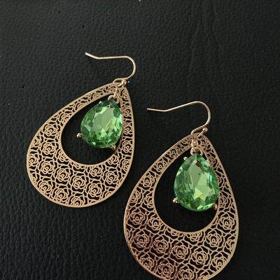 Sale Photo Thumbnail #147: Pair of gold-tone dangle drop earrings featuring a rose-patterned filigree teardrop design with center facetted peridot-green glass or crystal teardrops. Fitted with French wire hooks. Each earring measures approximately 2.25 inches in length. In good pre