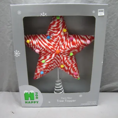 Sale Photo Thumbnail #110: H for Happy yarn star Christmas tree topper, in original retail packaging featuring red and white striped yarn decorated with colorful pom-poms.