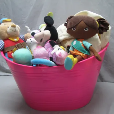 Sale Photo Thumbnail #43: Hot pink plastic tub filled with assorted stuffed animals and plush toys, including Minnie Mouse and a Girl Scout doll.