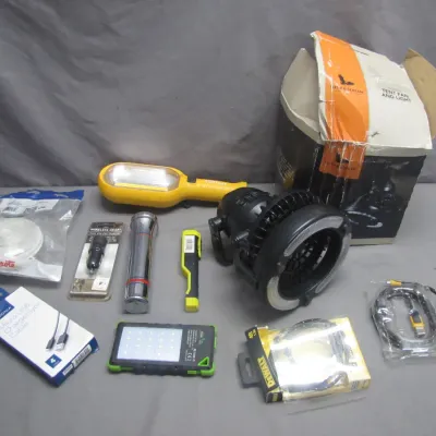Sale Photo Thumbnail #83: Assortment of portable lighting, outdoor gear, and electronics including a Field & Stream tent fan with light, flashlights, solar LED light panel, and charging cables.