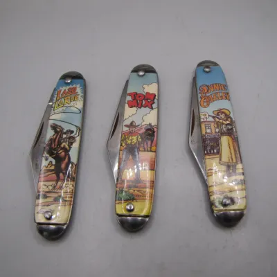 Sale Photo Thumbnail #15: Set of three vintage novelty folding pocket knives featuring Western figures Lash LaRue, Tom Mix, and Annie Oakley.