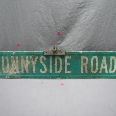 Sale Photo Thumbnail #123: Vintage green metal street sign reading 'Sunnyside Road' with original top mounting hardware, displaying weathering and surface wear.
