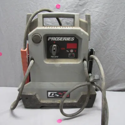 Sale Photo Thumbnail #149: DSR ProSeries PSJ-2212 portable 12V jump starter and power pack, showing light surface wear and dust from use.