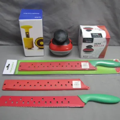 Sale Photo Thumbnail #89: Collection of specialty kitchen gadgets, including a boxed pineapple corer-slicer, a boxed Kitchen Gizmo herb roller, and two novelty watermelon-themed serrated knives with red blades and green handles.
