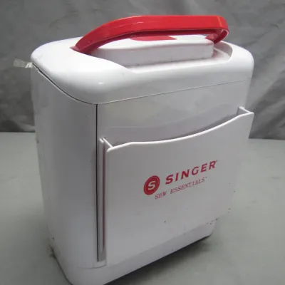 Sale Photo Thumbnail #283: Singer Sew Essentials plastic portable sewing caddy with a red carrying handle and side pocket.