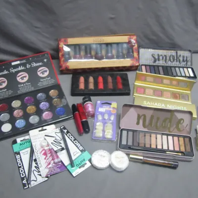 Sale Photo Thumbnail #176: Assorted makeup and beauty items, including eyeshadow palettes, nail polish sets, liquid lipsticks, and packaged eyeliners.