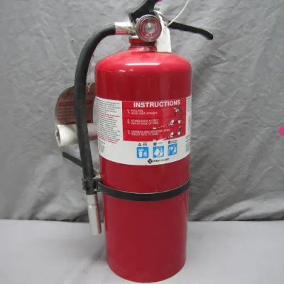 Sale Photo Thumbnail #63: Red First Alert fire extinguisher complete with hose, mounting bracket, and instructional labeling.