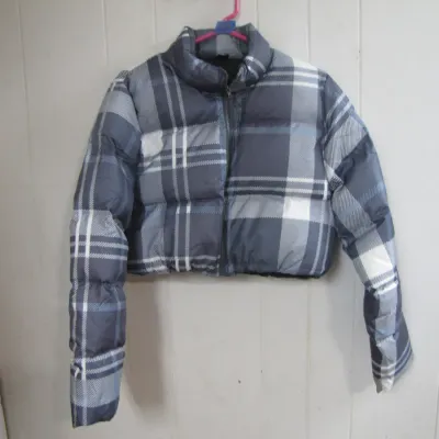 Sale Photo Thumbnail #42: Cropped plaid puffer jacket in shades of grey and white, featuring a full front zipper and high collar.