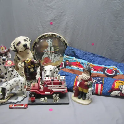 Sale Photo Thumbnail #191: Collection of firefighter and Dalmatian dog collectibles, including statues, a wall clock, a model fire truck, and a printed blanket.