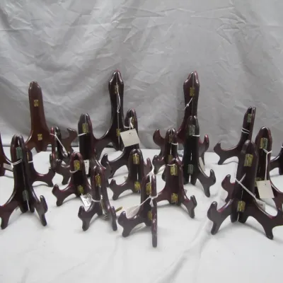 Sale Photo Thumbnail #232: Collection of wooden folding plate display stands in varying sizes with brass hinges.