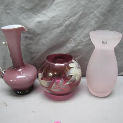 Sale Photo Thumbnail #121: Group of three pink glassware items, including a blown glass pitcher, a hand-painted floral glass bowl, and a BoConcept frosted glass vase.