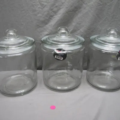 Sale Photo Thumbnail #146: Trio of large clear glass storage canisters with fitted knob lids, in excellent condition with original tags.