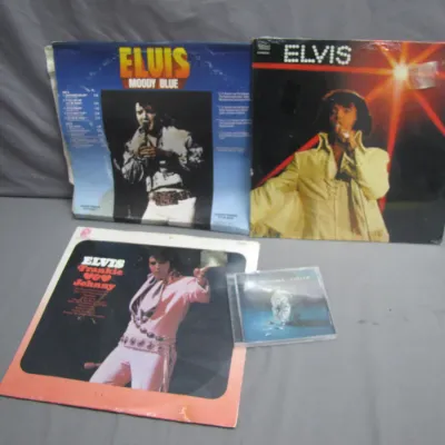Sale Photo Thumbnail #166: Collection of Elvis Presley vinyl albums including 'Moody Blue' and 'Frankie and Johnny', paired with a compact disc.