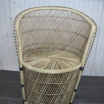 Sale Photo Thumbnail #246: Vintage wicker peacock tub chair featuring a open lattice weave design with black contrast accents.