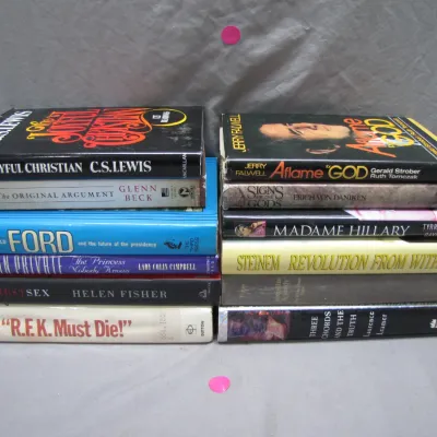 Sale Photo Thumbnail #213: Two stacks of vintage hardcover non-fiction books, including titles by C.S. Lewis, Erich von Däniken, and Gloria Steinem.