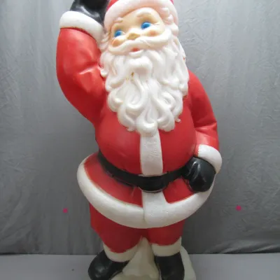 Sale Photo Thumbnail #144: Vintage plastic Santa Claus blow mold holiday lawn decoration, depicting Santa waving atop a snowy base with minor paint wear.