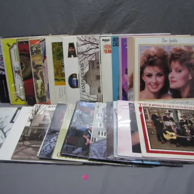 Sale Photo Thumbnail #159: Collection of vintage country and bluegrass vinyl LP albums, featuring artists such as The Judds, Randy Travis, Alabama, and The Johnson Mountain Boys.