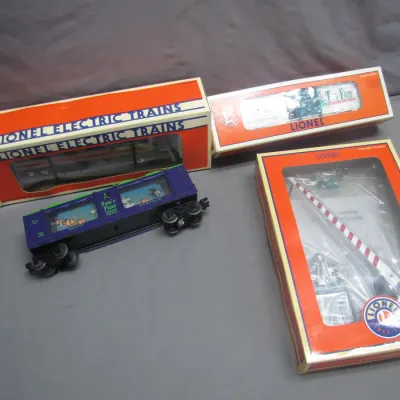 Sale Photo Thumbnail #253: Collection of Lionel electric train cars and track accessories in original packaging, including a Pete's Place aquarium car.
