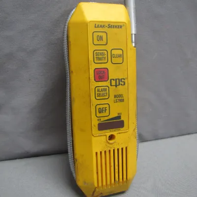 Sale Photo Thumbnail #275: CPS Leak-Seeker Model LS790B refrigerant leak detector with flexible probe in a yellow plastic housing.