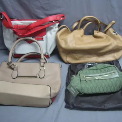 Sale Photo Thumbnail #169: Collection of four women's handbags, including a tan leather tote, a red and white shoulder bag, a beige satchel, and a small green quilted Marc Jacobs bag with tags.