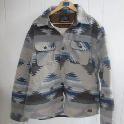 Sale Photo Thumbnail #237: Jachs New York fleece-lined jacket featuring a Southwestern geometric print pattern in shades of grey, blue, and black.
