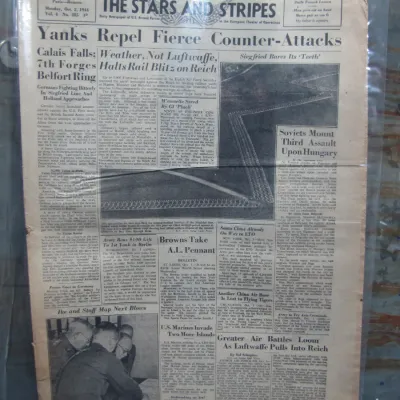 Sale Photo Thumbnail #81: Original October 2, 1944 front page of The Stars and Stripes US Armed Forces newspaper covering World War II European Theater events, showing age-related toning and fold lines.