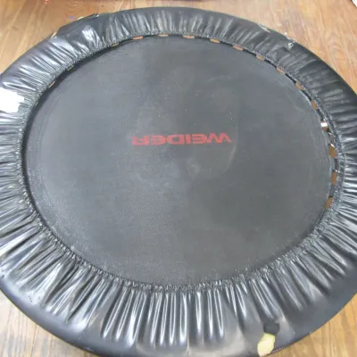 Sale Photo Thumbnail #295: Weider mini fitness trampoline with black safety pad skirting, showing minor wear around the padded edge.