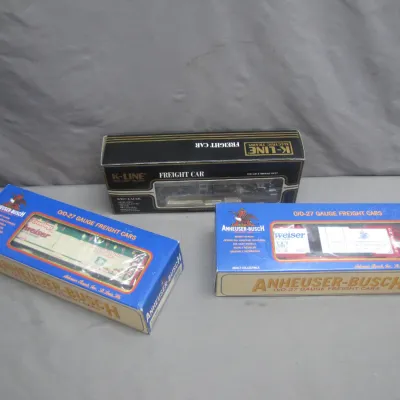 Sale Photo Thumbnail #255: Three boxed K-Line O/O-27 gauge model train freight cars, featuring Anheuser-Busch Budweiser branding.