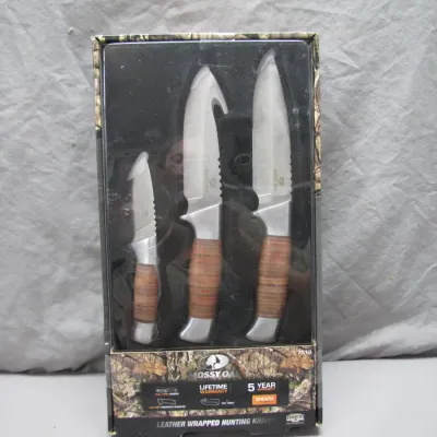 Sale Photo Thumbnail #65: Mossy Oak 3-piece leather wrapped hunting knife set in original packaging.