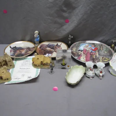 Sale Photo Thumbnail #210: Collection of decorative collectibles, including horse-themed plates with a certificate of authenticity, Lilliput Lane miniature cottages, small porcelain figurines, and a clear Lucite paperweight.