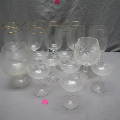 Sale Photo Thumbnail #77: Collection of assorted glassware, including gold-rimmed goblets, etched floral champagne coupes, and brandy snifters.