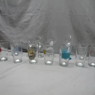 Sale Photo Thumbnail #289: Collection of mixed glassware, including pint glasses with various promotional logos and stemware.