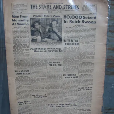 Sale Photo Thumbnail #262: Vintage July 24, 1945 issue of The Stars and Stripes Southern France edition newspaper, preserved in a plastic sleeve showing age-appropriate toning and edge wear.