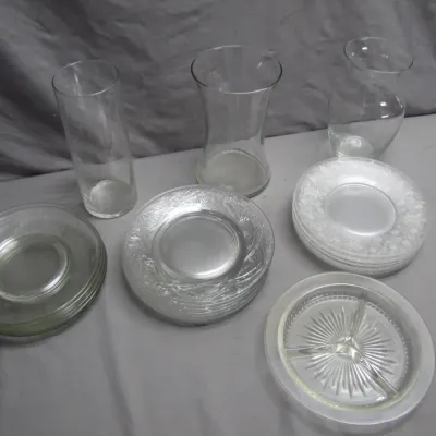 Sale Photo Thumbnail #178: Collection of clear glassware, including three flower vases and multiple stacks of patterned dessert plates and saucers.