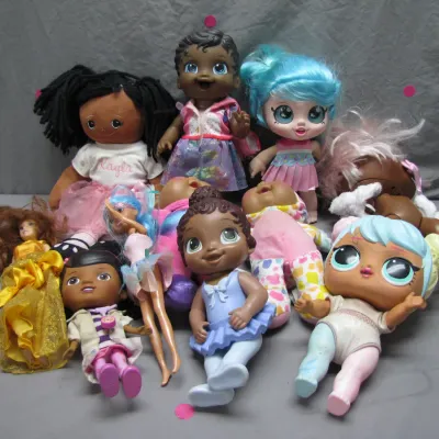Sale Photo Thumbnail #78: Mixed lot of modern children's dolls, including Baby Alive, Doc McStuffins, L.O.L. Surprise!, and cloth rag dolls.
