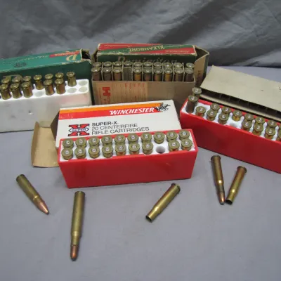 Sale Photo Thumbnail #187: Vintage rifle ammunition lot including Winchester Super-X centerfire cartridges and Remington Kleanbore boxes with brass casings.