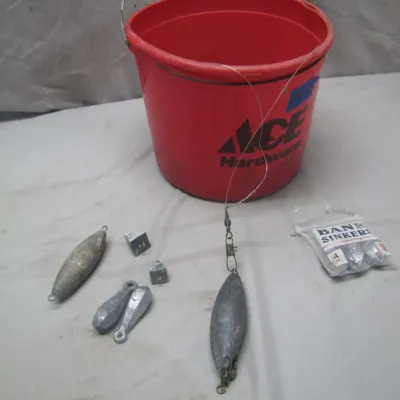Sale Photo Thumbnail #299: Small red Ace Hardware bucket paired with assorted lead fishing sinkers, weights, and a packaged set of bank sinkers.
