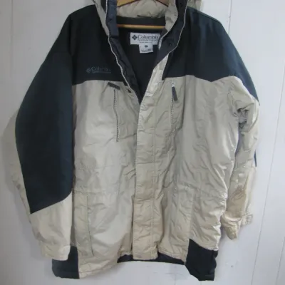 Sale Photo Thumbnail #227: Vintage Columbia Sportswear two-tone winter parka jacket featuring a zip front, attached hood, and multiple pockets.
