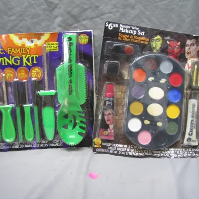 Sale Photo Thumbnail #64: Vintage Halloween accessories including a 20-piece family pumpkin carving kit and a Monster Value theatrical makeup set, both in original blister packaging.