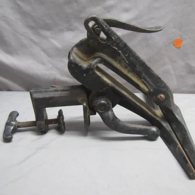 Sale Photo Thumbnail #28: Antique cast iron clamp-on saw vise, showing age-appropriate wear and patina.