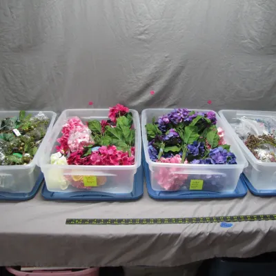Sale Photo Thumbnail #107: Four clear plastic storage bins filled with assorted faux floral stems, greenery, and crafting supplies.
