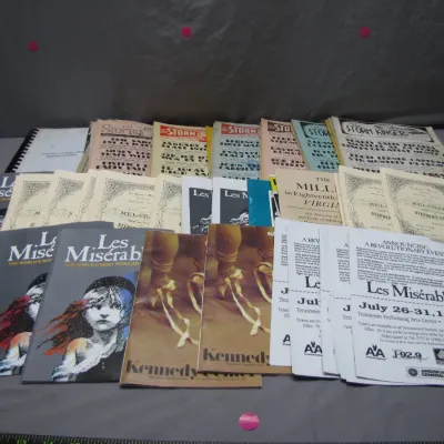 Sale Photo Thumbnail #209: Collection of vintage theater memorabilia and printed matter, including Les Misérables souvenir programs, promotional flyers from a 1994 production, Kennedy Center programs, and vintage sheet music booklets.
