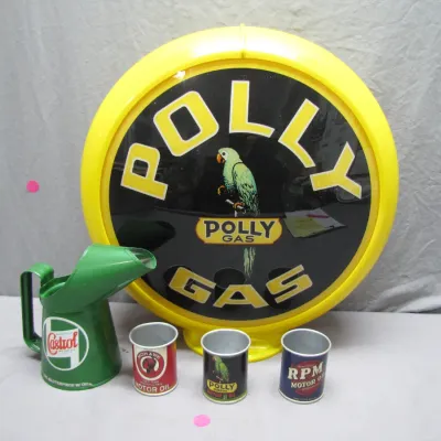 Sale Photo Thumbnail #198: Vintage-style Polly Gas illuminated globe lens alongside a green Castrol oil pour spout pitcher and three small vintage-style oil can cups.