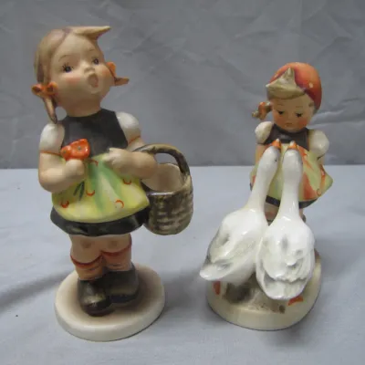 Sale Photo Thumbnail #296: Pair of vintage Goebel Hummel porcelain figurines featuring young girls with a basket and geese.