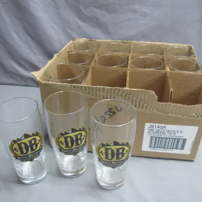 Sale Photo Thumbnail #127: Box set of Devils Backbone Brewing Company 16 oz pint glasses.