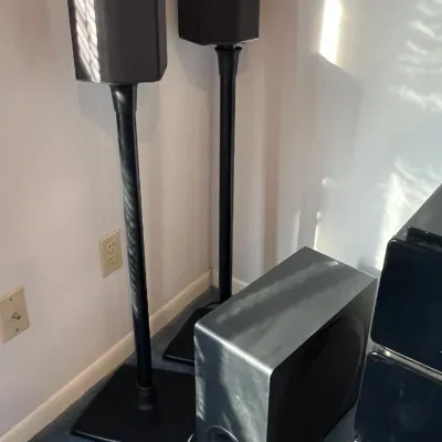 Sale Photo Thumbnail #35: Pair of black satellite speakers on tall stands accompanied by a matching powered subwoofer.