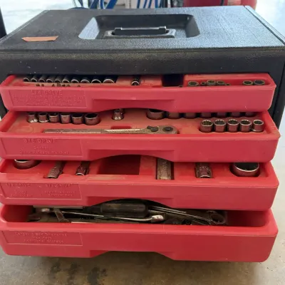 Sale Photo Thumbnail #7: Vintage Craftsman molded plastic mechanic's tool chest featuring four slide-out red organizer trays filled with assorted sockets, ratchets, and hand tools.